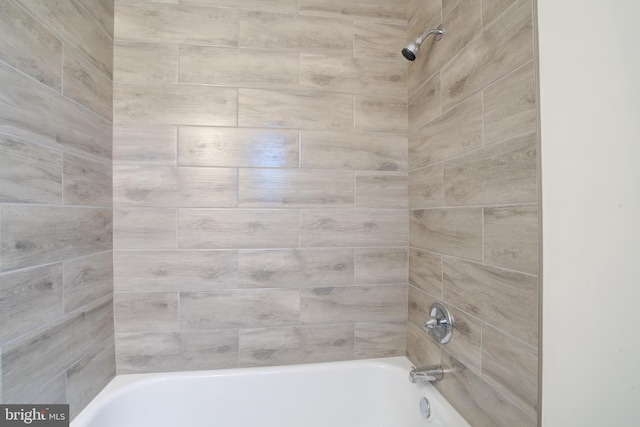 bathroom with shower / bathing tub combination