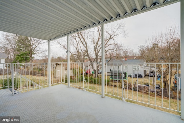 view of patio / terrace featuring a residential view and fence