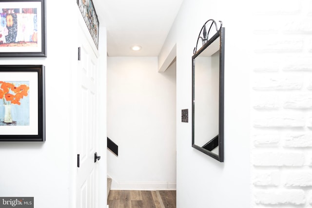 hall with recessed lighting, wood finished floors, and baseboards