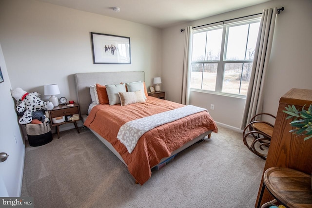 carpeted bedroom with baseboards