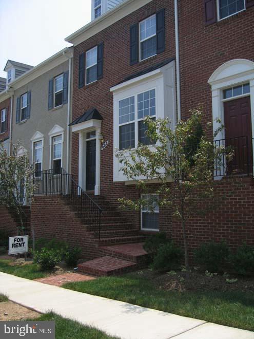 view of property with brick siding