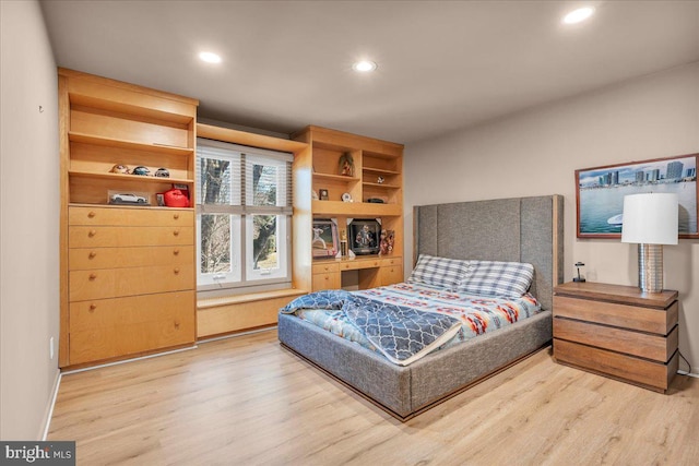 bedroom featuring recessed lighting, baseboards, and wood finished floors