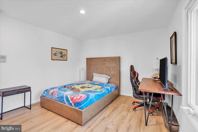 bedroom with recessed lighting, baseboards, and wood finished floors