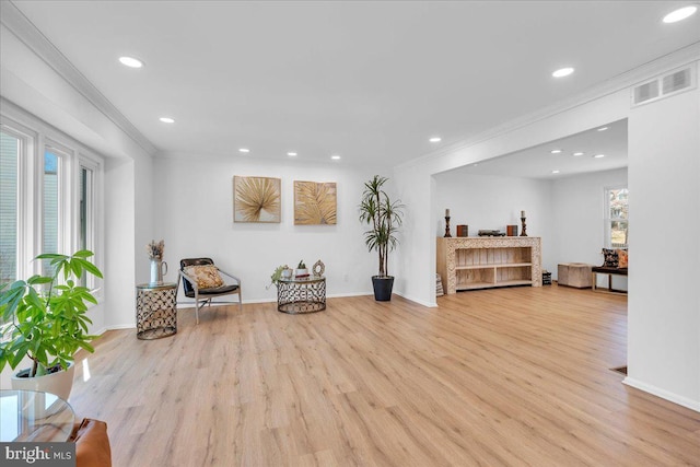 living area featuring crown molding, recessed lighting, wood finished floors, and visible vents