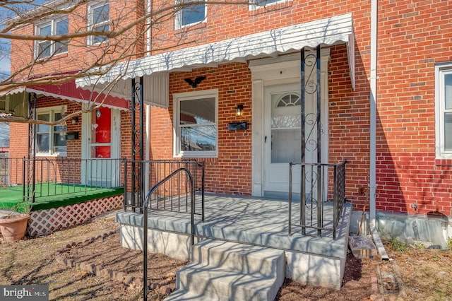 entrance to property with brick siding