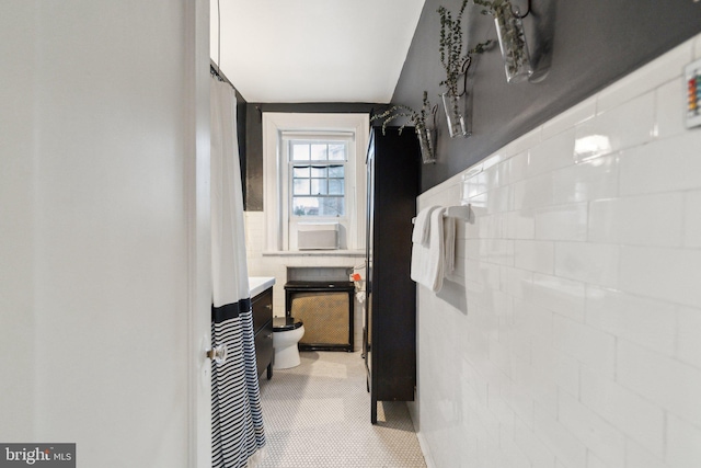 corridor with tile walls and wainscoting