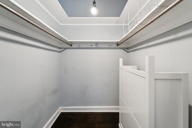 spacious closet with wood finished floors