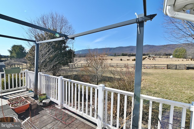 deck featuring a yard and a mountain view