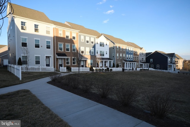 view of community featuring a residential view and fence