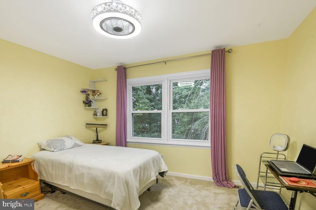 carpeted bedroom with baseboards