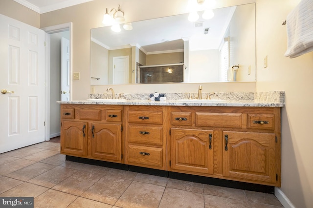 bathroom featuring double vanity, a shower stall, ornamental molding, and a sink