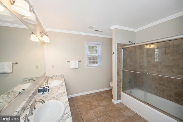 bathroom with ornamental molding and a sink