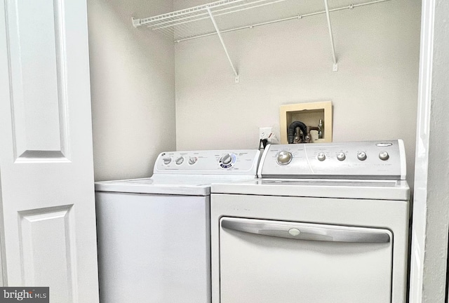 washroom with laundry area and washing machine and clothes dryer