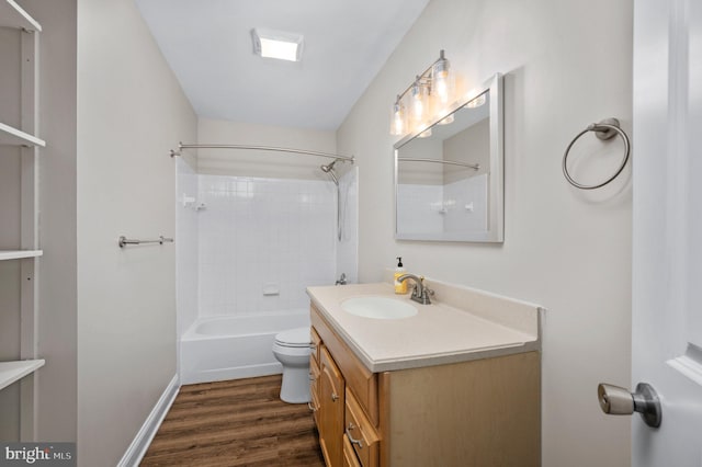 bathroom featuring vanity, shower / bath combination, wood finished floors, and toilet