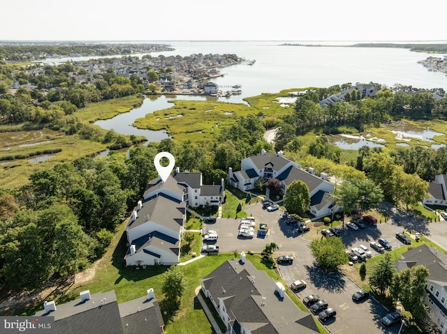 bird's eye view with a water view and a residential view