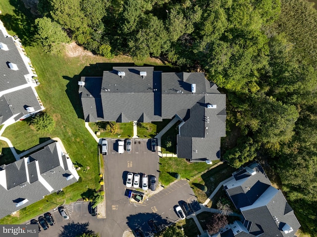 birds eye view of property with a residential view