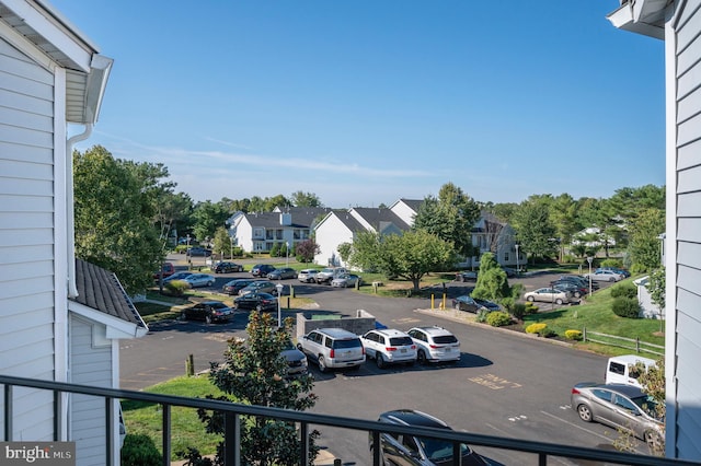 uncovered parking lot with a residential view