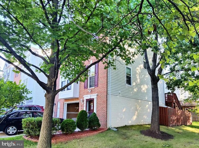 view of side of home featuring brick siding