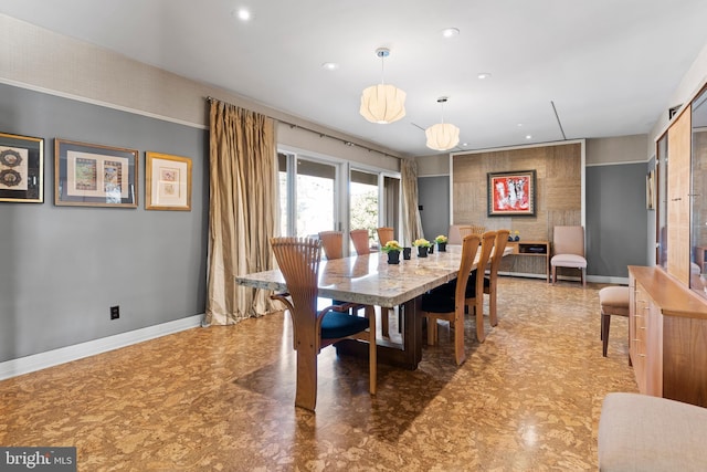 dining room featuring recessed lighting and baseboards