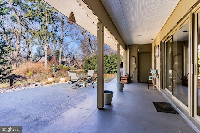 view of patio featuring outdoor dining area