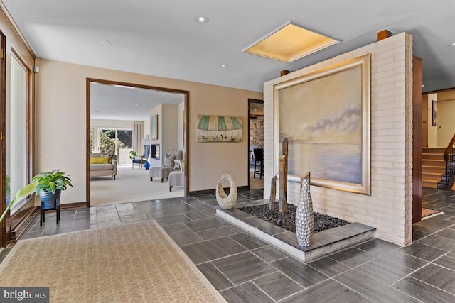 interior space with recessed lighting, stairway, and baseboards