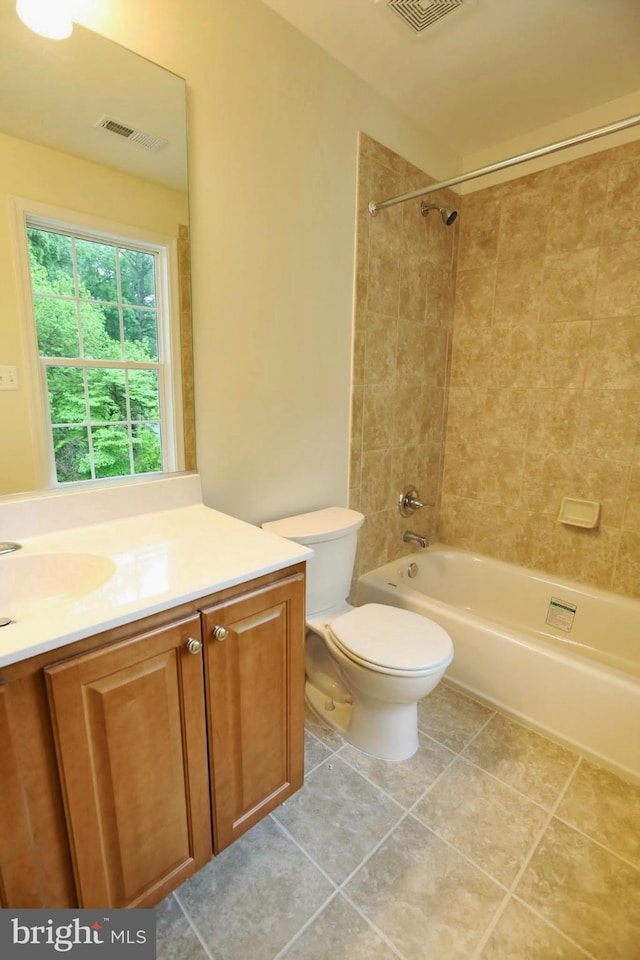 full bathroom with toilet, washtub / shower combination, visible vents, and vanity