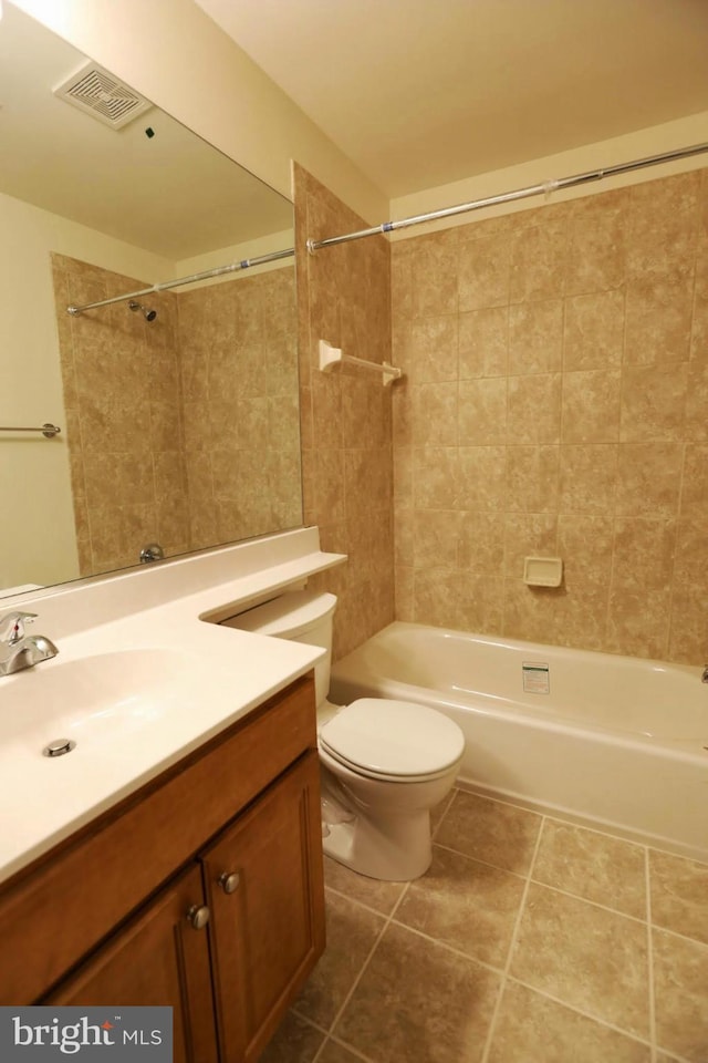 bathroom with tile patterned flooring, toilet, vanity, visible vents, and shower / bathing tub combination