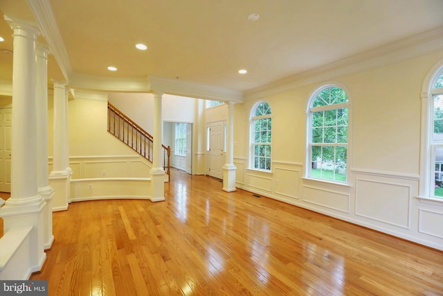 interior space with recessed lighting, wood-type flooring, decorative columns, and stairs