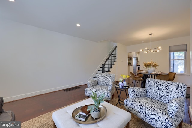 30 N Marshall St, Lancaster, PA 17602 - living area with stairs, an inviting chandelier, baseboards, visible vents, and wood finished floors