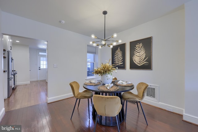 30 N Marshall St, Lancaster, PA 17602 - dining space with dark wood-type flooring, baseboards, a chandelier, and visible vents