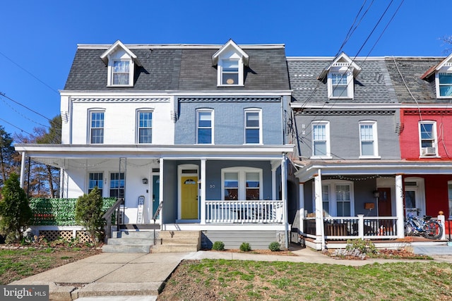 30 N Marshall St, Lancaster, PA 17602 - view of front of house with brick siding, a shingled roof, and a porch