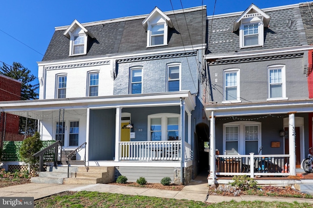 30 N Marshall St, Lancaster, PA 17602 - view of front of property featuring a porch, a shingled roof, and mansard roof