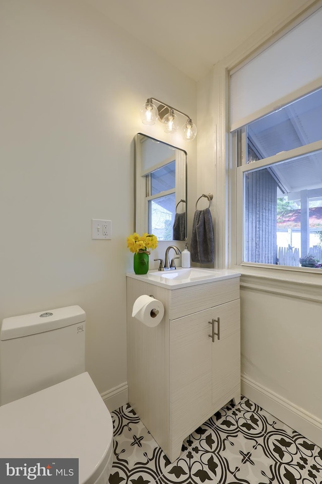 30 N Marshall St, Lancaster, PA 17602 - bathroom featuring toilet, plenty of natural light, baseboards, and vanity