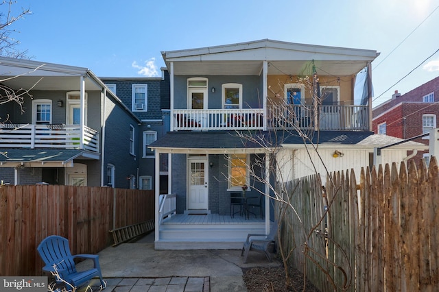 30 N Marshall St, Lancaster, PA 17602 - view of front of property with brick siding, a porch, fence, and a patio area