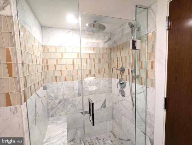 bathroom featuring a shower stall