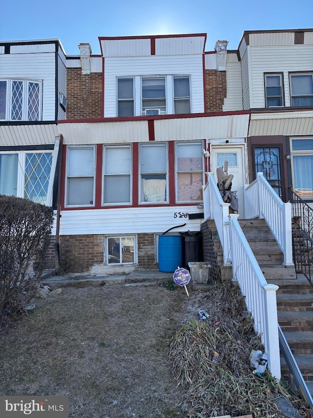 multi unit property featuring brick siding