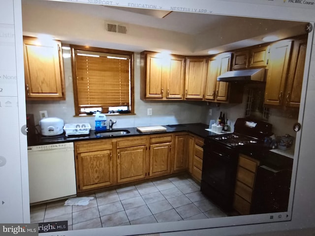 kitchen with black range with gas cooktop, dishwasher, dark countertops, under cabinet range hood, and a sink