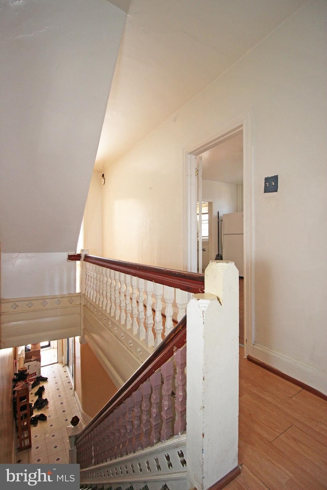 interior space with baseboards and wood finished floors