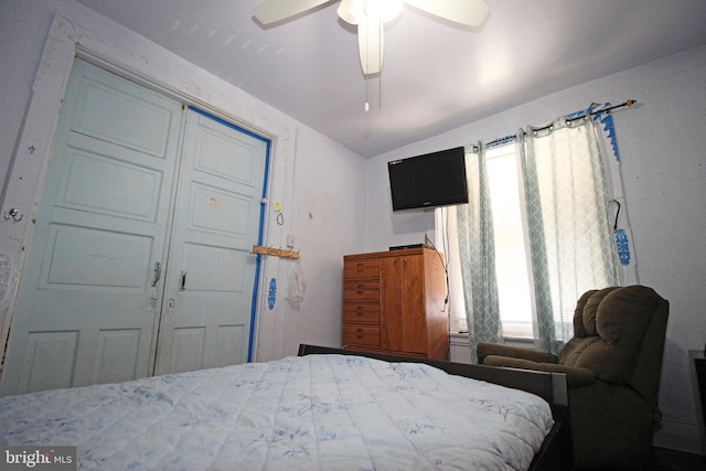 bedroom with ceiling fan and a closet