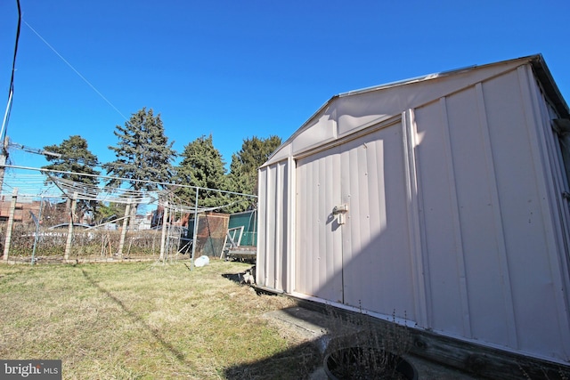 view of shed with fence