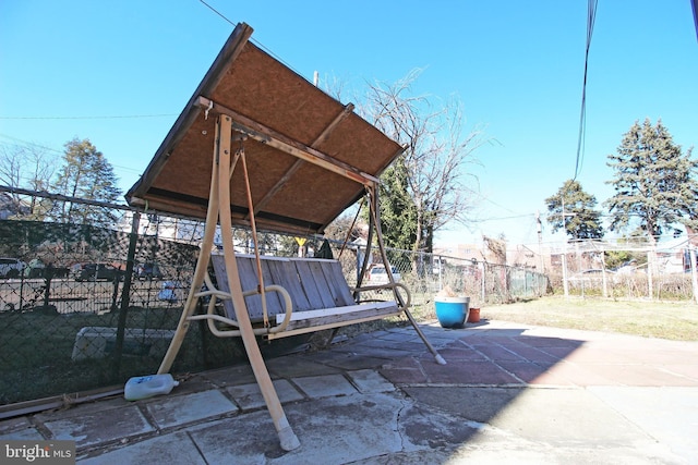 view of patio / terrace featuring fence