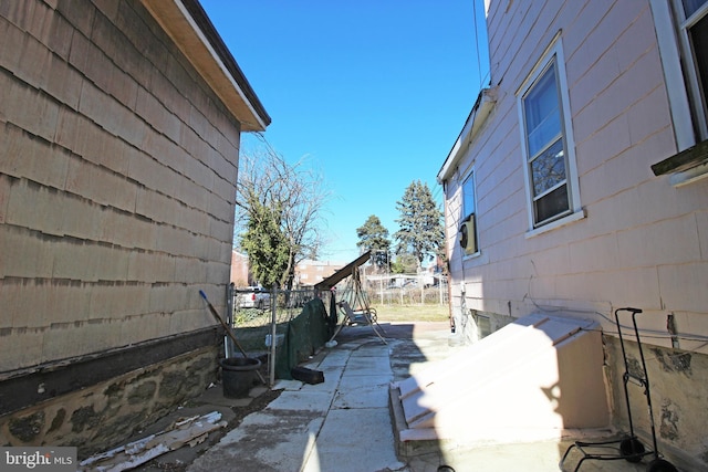 view of home's exterior with fence