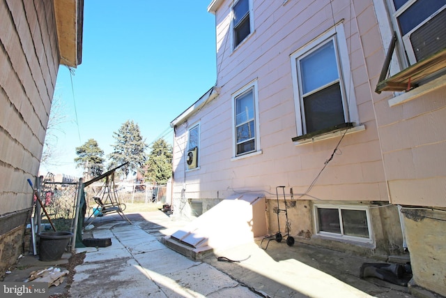 view of side of home featuring a patio area