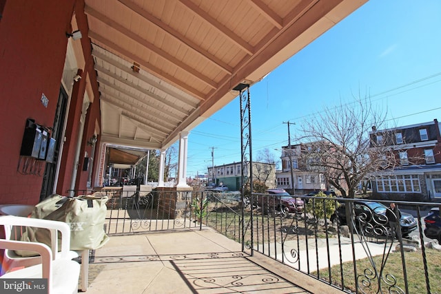 view of patio featuring a balcony