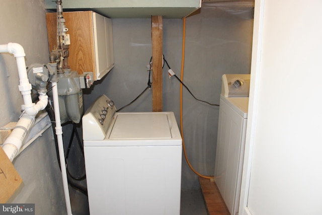 laundry area featuring washing machine and clothes dryer