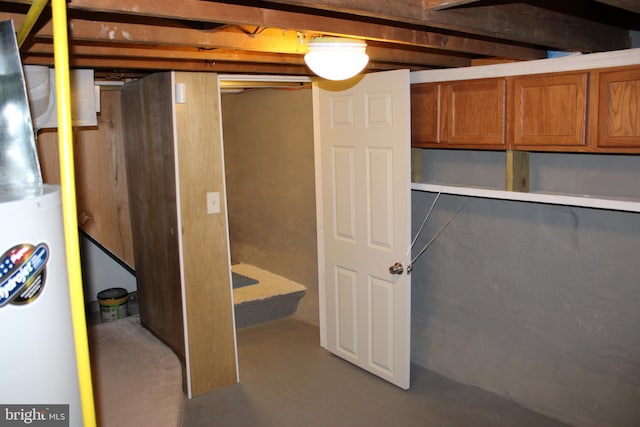 unfinished basement with water heater