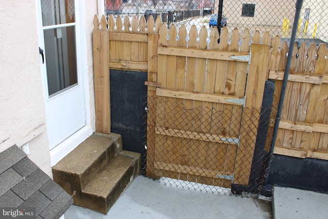 exterior space featuring entry steps, fence, and stucco siding