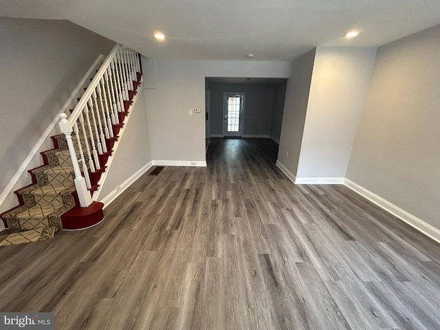 foyer entrance with stairs, dark wood-style flooring, recessed lighting, and baseboards