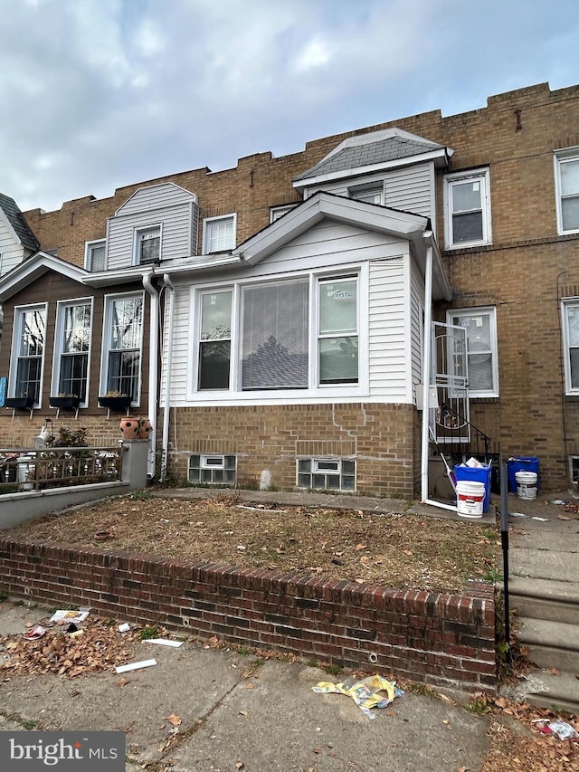 view of front of home with brick siding