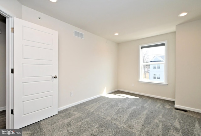 spare room featuring recessed lighting, visible vents, baseboards, and carpet floors